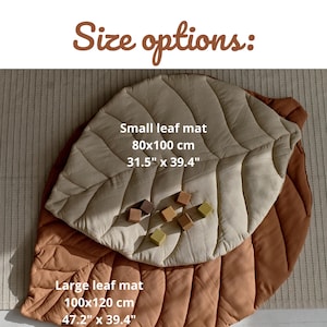 May include: Two linen leaf-shaped play mats in beige and brown. The smaller mat measures 31.5 inches by 39.4 inches and the larger mat measures 47.2 inches by 39.4 inches.  "Small leaf mat 80x100 cm 31.5" x 39.4" Large leaf mat 100x120 cm 47.2" x 39.4"