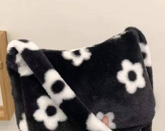 fluffy white bag with black flowers