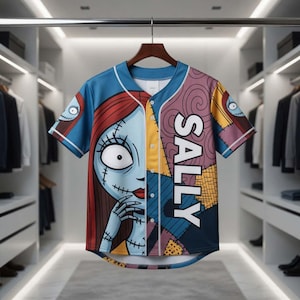 May include: A short-sleeved baseball jersey featuring a split design with the character Sally from The Nightmare Before Christmas. The left side shows Sally's face, while the right side has patchwork patterns and the name "SALLY" in white.