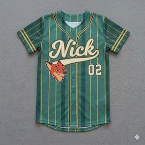 May include: Green baseball jersey with gold vertical stripes, the name "Nick" in cream script, and the number "02". Features a cartoon fox head on the front. Short-sleeved, button-down shirt.