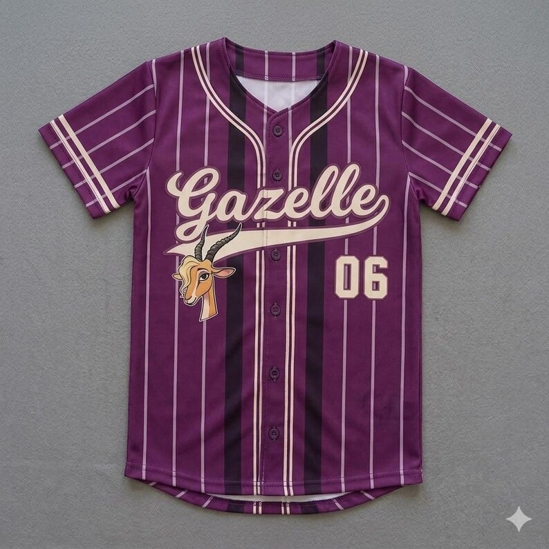 May include: Purple baseball jersey with vertical stripes and the word "Gazelle" in a cursive font. The jersey features a cartoon gazelle head and the number "06". The sleeves and collar have white accents.