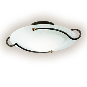May include: An oval-shaped ceiling light fixture with a frosted glass shade. The fixture has dark metal accents, including curved arms and small gold-colored details. The design is modern and elegant, suitable for interior lighting.