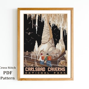 May include: Cross stitch pattern of Carlsbad Caverns National Park. The pattern features a large cave with stalactites and stalagmites, and two people walking on a path. The text "Carlsbad Caverns National Park" is at the bottom of the pattern.