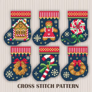 May include: A collection of six navy blue cross-stitch Christmas stocking patterns. Each stocking features a different festive design, including a gingerbread house, gingerbread person, candy cane, wreath, and a peppermint candy. The text "CROSS STITCH PATTERN" is at the bottom.