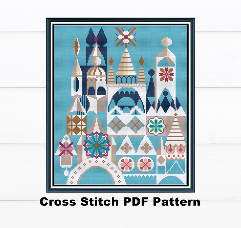 May include: A framed cross-stitch pattern featuring a whimsical architectural design in shades of blue, tan, and white. The image includes a variety of geometric shapes and floral accents. The text "Cross Stitch PDF Pattern" is at the bottom.