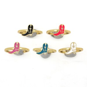 May include: Five gold rings with different colored enamel cowboy boot charms. The boots are black, red, pink, teal, and white.