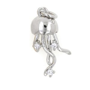 May include: Silver charm in the shape of a jellyfish with three dangling tentacles and three clear rhinestones.