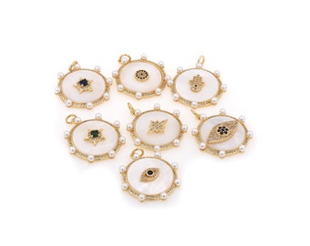 May include: Eight gold-tone pendants with white mother-of-pearl and crystal accents. Each pendant features a different design, including a star, an eye, and a hamsa hand.