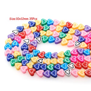 May include: A string of 35 colorful heart-shaped beads, each with a white outline. The beads are approximately 10mm by 12mm in size.  Size: 10x12mm 35Pcs