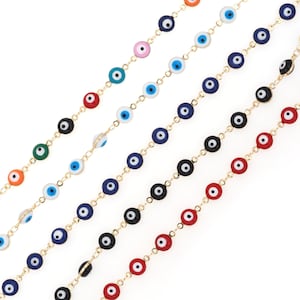 May include: Six gold chains with colorful evil eye beads. The beads are in various colors, including red, blue, black, green, and pink.