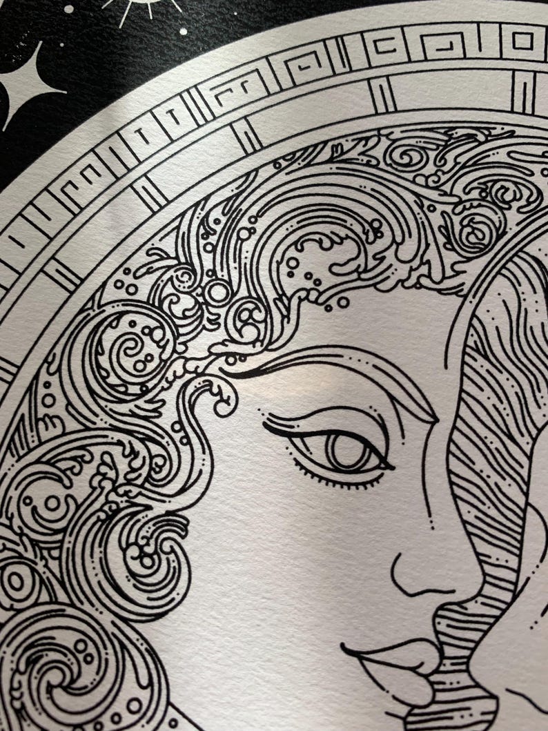 May include: A black and white line art illustration featuring a profile of a face with flowing, wave-like hair patterns. The design is enclosed within a circular frame decorated with a geometric Greek key border and set against a dark background.