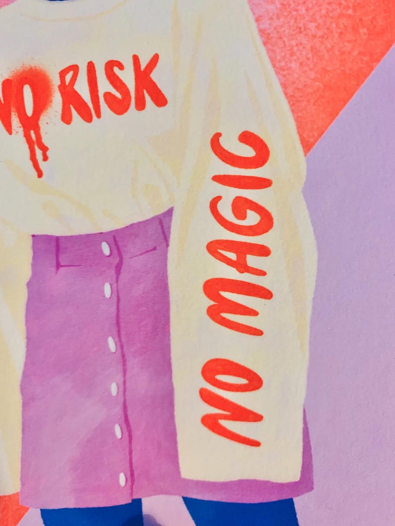May include: A long-sleeve cream-colored shirt featuring the red text NO RISK on the chest and NO MAGIC printed vertically down the sleeve, paired with a purple button-front skirt. The shirt has a spray-painted red heart detail near the text.