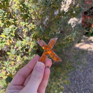 X Resin Keychain with Orange Glitter