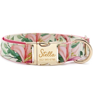May include: A pink and green floral dog collar with a gold buckle and a personalized name tag that reads "Stella" and a phone number.
