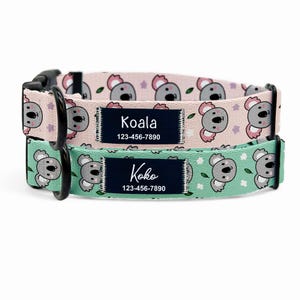 May include: Two dog collars with koala bear patterns. One collar is light pink with white flowers, the other is mint green with white flowers. Each collar has a navy blue tag with a name and phone number.