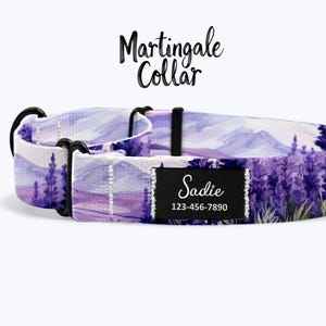 May include: Purple and white dog collar with a mountain and lavender floral pattern. The collar has a black metal buckle and a black tag that says "Sadie" and "123-456-7890". The collar is labeled as a "Martingale Collar".