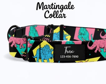 May include: Black martingale collar with a colorful dinosaur pattern. The collar features pink, blue, and green dinosaurs on a black background with yellow accents. The collar has the text "Martingale Collar" and a black label with the name "Trex" and a phone number.