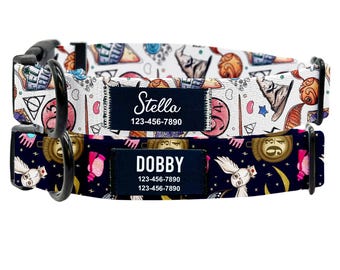 May include: Two dog collars with a Harry Potter theme. The top collar is white with a pink, blue, and yellow pattern. The bottom collar is black with a pink, blue, and yellow pattern. Both collars have a black tag with white text. The top tag says "Stella 123-456-7890". The bottom tag says "Dobby 123-456-7890 123-456-7890".