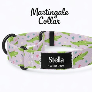 May include: A lavender Martingale collar featuring a pattern of green alligators and pink stars. The collar has a black metal D-ring and a black name tag that reads "Stella" and a phone number.