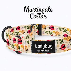May include: A cream-colored Martingale collar with a ladybug pattern. The collar features red, orange, and black ladybugs, green leaves, and the word "Ladybug" on a black label with a phone number.