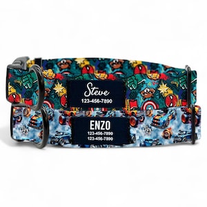 May include: Two dog collars with a vibrant pattern of cartoon cars, superheroes, and stars. Each collar has a navy blue patch with a name and phone number. The top collar says "Steve" and the bottom collar says "Enzo".