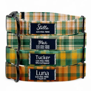 May include: Four dog collars with personalised name tags. The collars are green and orange plaid with black buckles. The name tags are black with white text. The name tags read "Stella 123-456-7890", "Max 123-456-7890", "Tucker 123-456-7890 Microchipped", and "Luna 123-456-7890 7 Apple Dr."