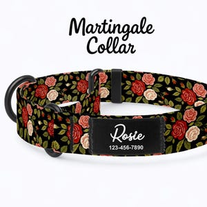 May include: A black Martingale collar with a floral rose pattern in red and cream colors. The collar features a black name tag with the name "Rosie" and a phone number. The collar is designed for dogs.