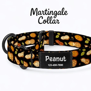 May include: Black Martingale dog collar with a peanut pattern. The collar features a black name tag with the name "Peanut" and a phone number. The collar is approximately 1 inch wide.