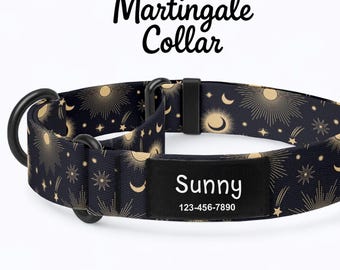 May include: A black Martingale dog collar with a celestial design featuring gold suns, moons, and stars. The collar includes a black name tag with the name "Sunny" and a phone number. The collar has black metal hardware.