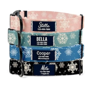May include: Four personalized dog collars stacked, each with a different color and snowflake pattern. The collars are pink, teal, blue, and black. Each collar has a name tag with a dog's name and contact information.