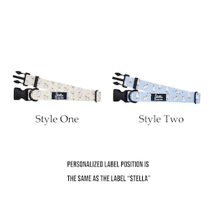 May include: Two dog collars with black buckles and adjustable straps. Style One is beige with white goose illustrations. Style Two is light blue with white goose illustrations. Both have a label that says "Stella". The text says "PERSONALIZED LABEL POSITION IS THE SAME AS THE LABEL 'STELLA'".