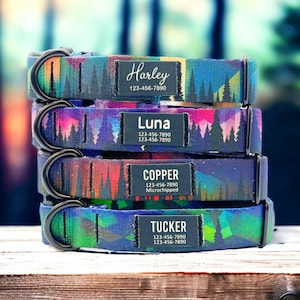 May include: Four colourful dog collars with geometric patterns and mountain silhouettes. Each collar has a personalised name tag with a phone number and the text "Microchipped" on one of the tags.