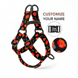 May include: Black dog harness featuring a poppy flower design in red and orange. The harness has adjustable straps and black metal hardware. The text "CUSTOMIZE YOUR NAME" is displayed. A small circle shows a close-up of the poppy flower pattern.