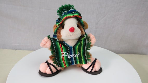 Peruvian guinea pig cuddly toy with chullo and poncho. Made in Peru. Fair trade.16 cm high x  17 cm across. Very cute !!