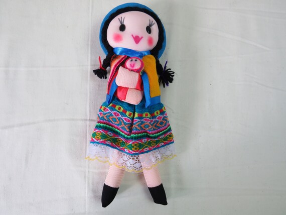 Peruvian rag dollie holding baby. Hand made in Peru. Length is 28 cm. Fair trade. Authentic