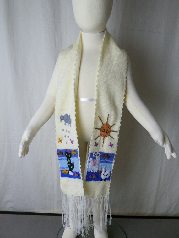 Childrens arpillera scarf from Peru with applique/embroidery work. Individually made in Peru.Fair Trade.Length=51" width=4"