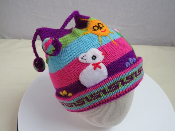 Childrens Peruvian arpillera bobble hats.Knitted beanie with applique/embroidery. Made in Peru. Fair Trade. Size fits 6 mths to 3yrs
