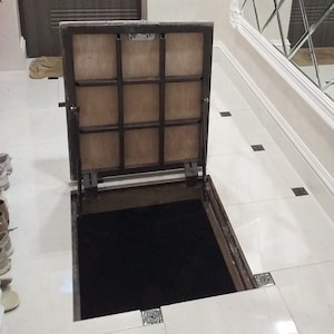 Cellar hatch door with gas struts Invisible floor trapdoor Hidden utility access panel Sewer plumbing metal hatchway Custom basement cover