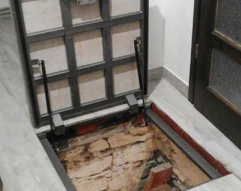 Custom floor hatch door for interior cellar and basement hatchway Flush-mounted trapdoor covered with laminate Recessed utility access panel