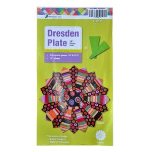 May include: A green and yellow package for a Dresden Plate patchwork template set. The package shows a colorful Dresden Plate design with 10 inch plates. The package includes instructions and two templates, one 18 inches and one 22.5 inches.