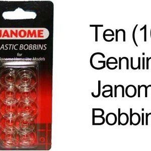 May include: A package of ten clear plastic Janome bobbins for sewing machines. The bobbins are displayed in a clear plastic case with a red and black backing. The package has the Janome logo and the words "Plastic Bobbins".