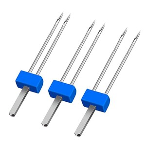 May include: A close-up of several sewing machine needles. Each needle has a silver shaft, a blue plastic block, and a silver, flat base. The needles are arranged in a row against a white background.