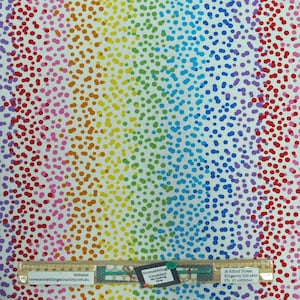 May include: White fabric with a rainbow pattern of small dots. The fabric has a repeating pattern of dots in shades of red, orange, yellow, green, blue, indigo, and violet. The fabric is ideal for quilting, crafts, and other sewing projects.