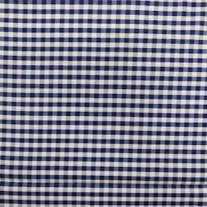 May include: A white and navy blue gingham fabric with a checkered pattern.