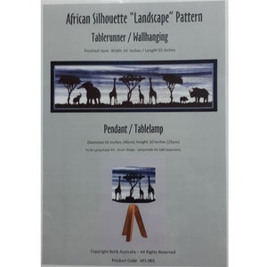 May include: A black and white pattern featuring a landscape with giraffes, elephants, and a rhinoceros. The pattern is titled "African Silhouette "Landscape" Pattern" and is available as a 16 inch by 55 inch tablerunner or wallhanging. The pattern can also be used to create a 16 inch diameter pendant or table lamp.