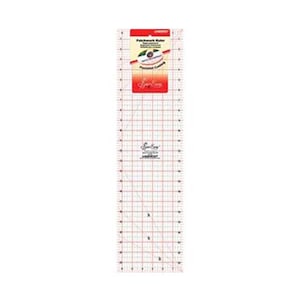 May include: A clear, rectangular patchwork ruler with red grid lines and measurement markings. The ruler has a red and white label at the top with the text "Patchwork Ruler" and "Precision Cutting". The brand name "Sew Easy" is printed on the ruler.
