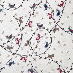 May include: White fabric featuring a repeating pattern of reindeer, snowflakes, and string lights. The reindeer are in various colours, including red, blue, and brown. The snowflakes are a light grey colour.