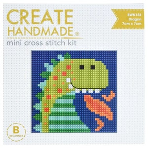 May include: A beginner cross stitch kit featuring a green dragon with orange flames. The kit is 7 inches by 7 inches and is labeled "Create Handmade" and "Dragon".