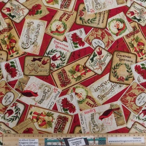 May include: Red and cream coloured fabric with a repeating pattern of vintage Christmas postcards. The postcards feature images of Santa Claus, cardinals, holly berries, and the text "Christmas Greetings".
