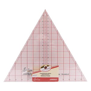 May include: A clear, triangular patchwork ruler with red grid lines and measurements in centimetres. The ruler has a label that reads "Patchwork Ruler" and "60 Triangle". The ruler measures approximately 30.5 x 35.2 cm.